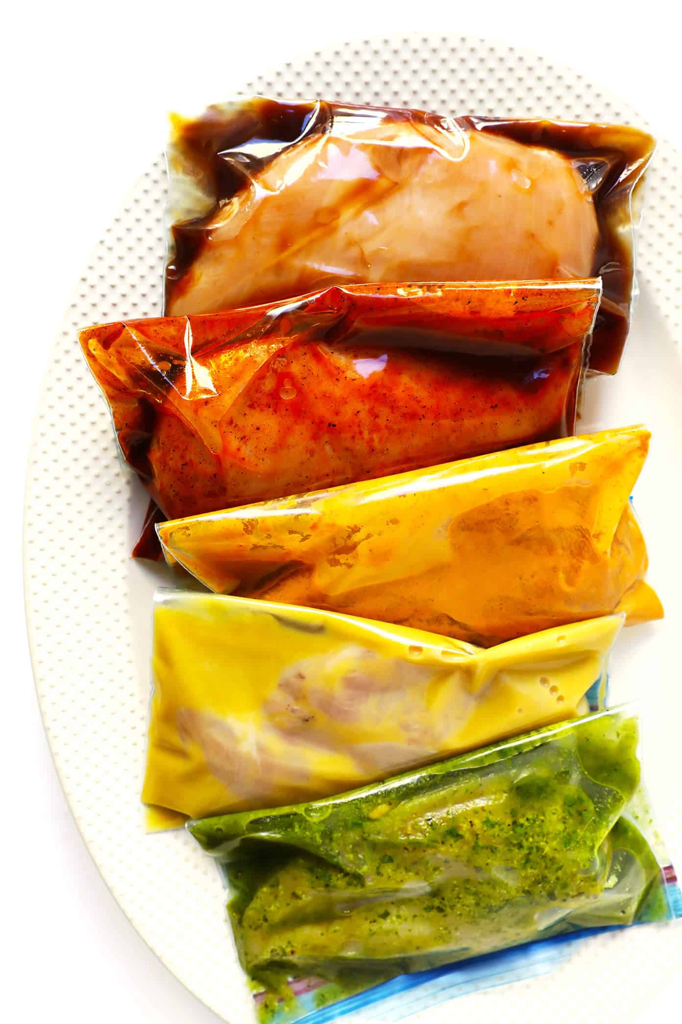 These 5 Easy Chicken Marinade Recipes -- Teriyaki, Enchilada, Tandoori, Honey Mustard and Pesto -- are freezer-friendly, perfect for #mealprep, naturally #glutenfree, and SO delicious. Use them for grilling, baking, stir-frying, or however you prefer! | gimmesomeoven.com #chicken #healthy #mealprep #dinner #recipe #marinade 5 Chicken Marinade Recipes