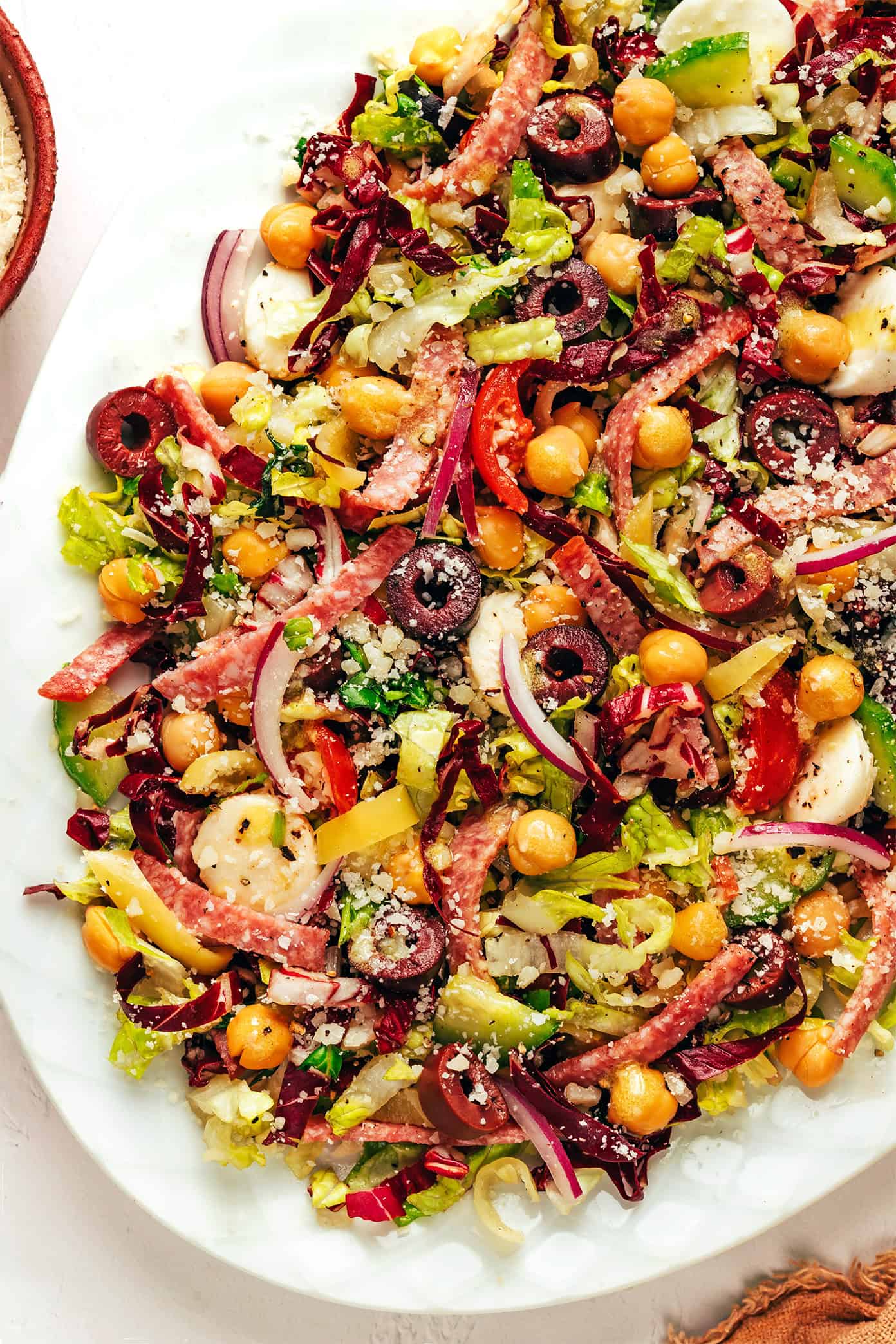 My favorite Italian chopped salad recipe is fresh, hearty, and bursting with zesty Italian flavors in each bite. | gimmesomeoven.com Italian Chopped Salad on a large serving plate