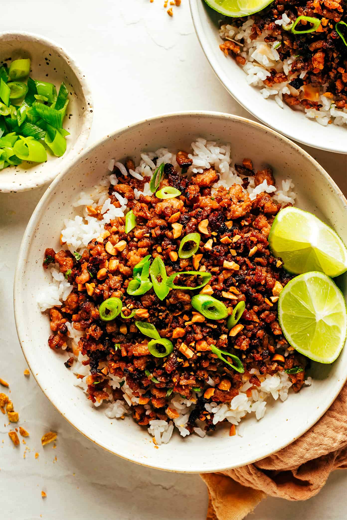 This Ginger Lime Pork with Coconut Rice recipe comes together in just 30 minutes and is bursting with sweet and savory flavors. It's also naturally gluten-free, easily adaptable with chicken, beef, turkey or seitan, and always makes for a delicious quick dinner. | gimmesomeoven.com Ginger Lime Pork with Coconut Rice