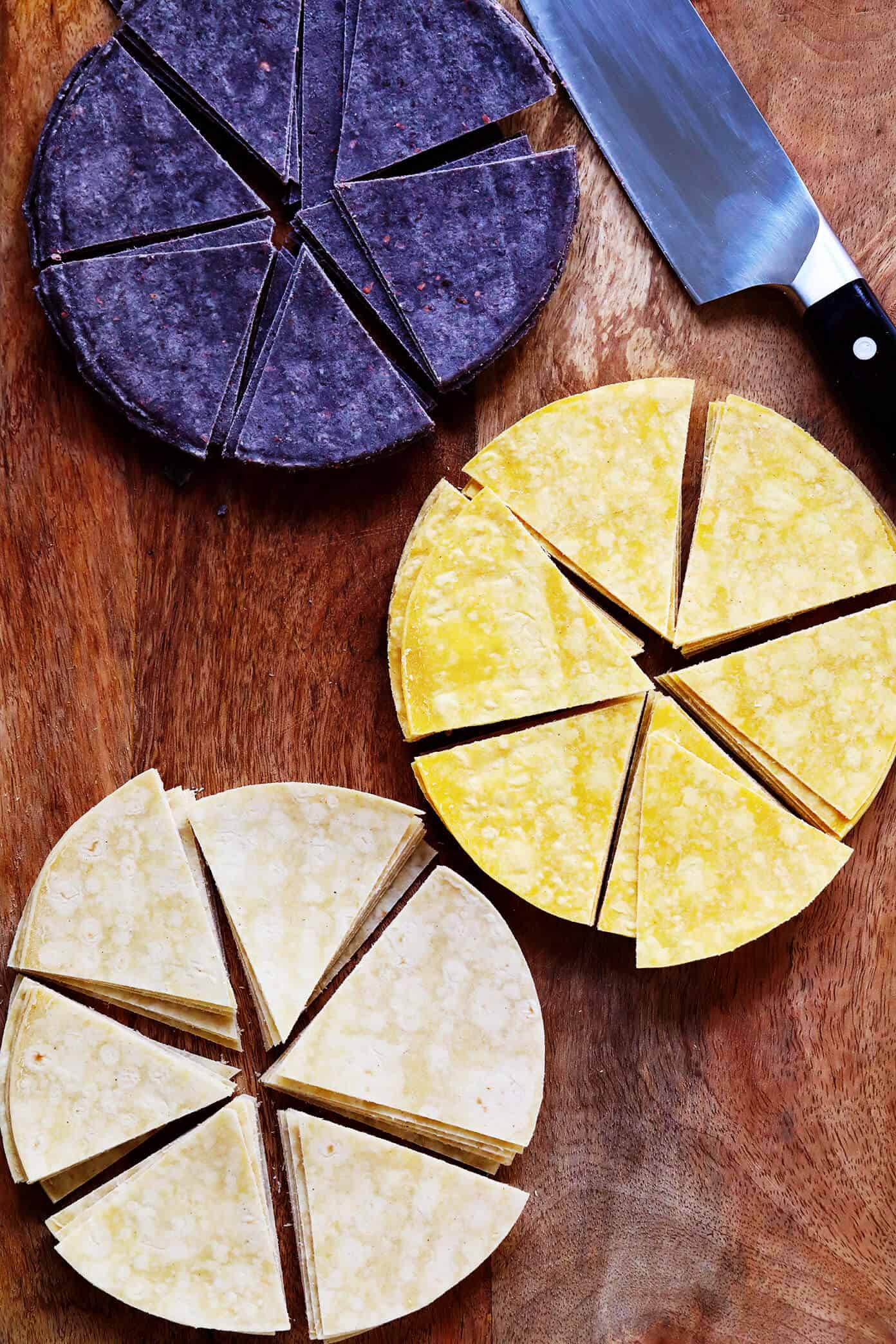 This homemade tortilla chips recipe is easy to make with 3 basic ingredients (corn tortillas, oil and salt) and always SO delicious! | gimmesomeoven.com #homemade #corn #tortilla #chips #glutenfree #vegan #vegetarian #appetizer #gameday #snack Blue, Yellow and White Corn Tortillas