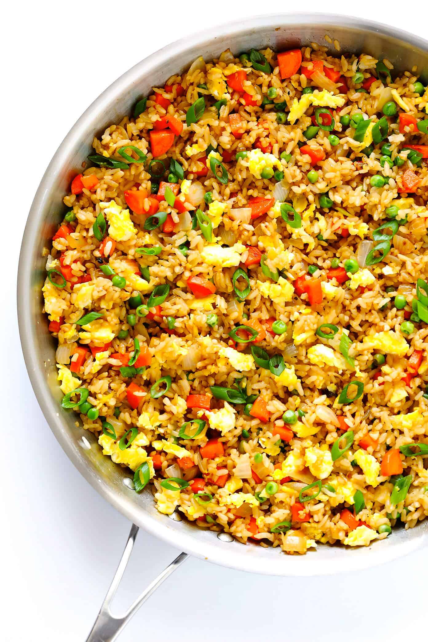 The BEST homemade fried rice recipe!! It only takes 15 minutes to make, it's easy to customize with your favorite add-ins (like chicken, pork, beef, shrimp, tofu, and/or vegetables), and it is SO flavorful and delicious! Way better than any Chinese takeout I've ever tried. ;) | gimmesomeoven.com #rice #friedrice #chinese #dinner #takeout #vegetarian #asian #easy The BEST Fried Rice Recipe from Gimme Some Oven
