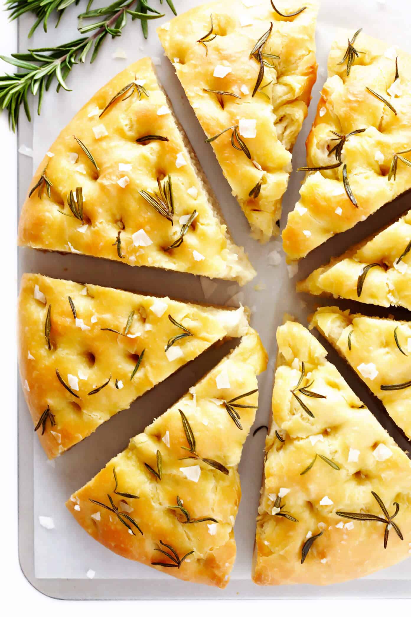 This delicious Rosemary Focaccia Bread recipe is easy to make, and topped with fresh rosemary, olive oil and flaky sea salt. Easy to make as a side for dinner, and it also freezes well! | gimmesomeoven.com #focaccia #bread #italian #side #vegetarian #baking Easy Focaccia Bread Recipe