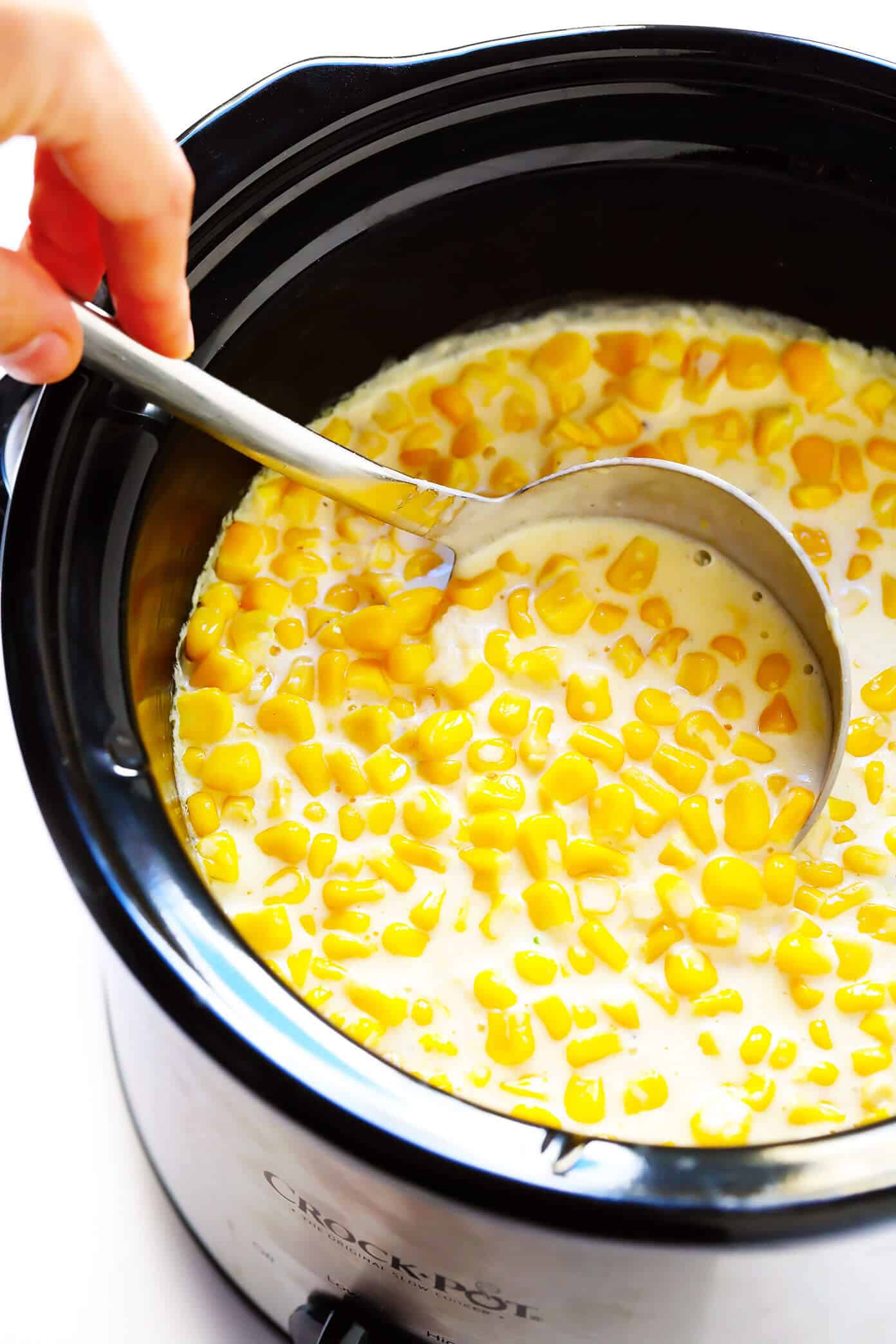 This slow cooker creamed corn recipe is super-easy to make in the Crock Pot (or on the stovetop), it's perfectly rich and creamy, and it's easy to customize with any of your favorite add-ins (herbs, cheese, etc). It's the throwback side dish that's always a crowd fave for Thanksgiving, Christmas, or anytime you're craving some classic comfort food. | gimmesomeoven.com #creamed #corn #thanksgiving #christmas #side #glutenfree #vegetarian #makeahead #crockpot #slowcooker Slow Cooker Creamed Corn (CrockPot or Stovetop)