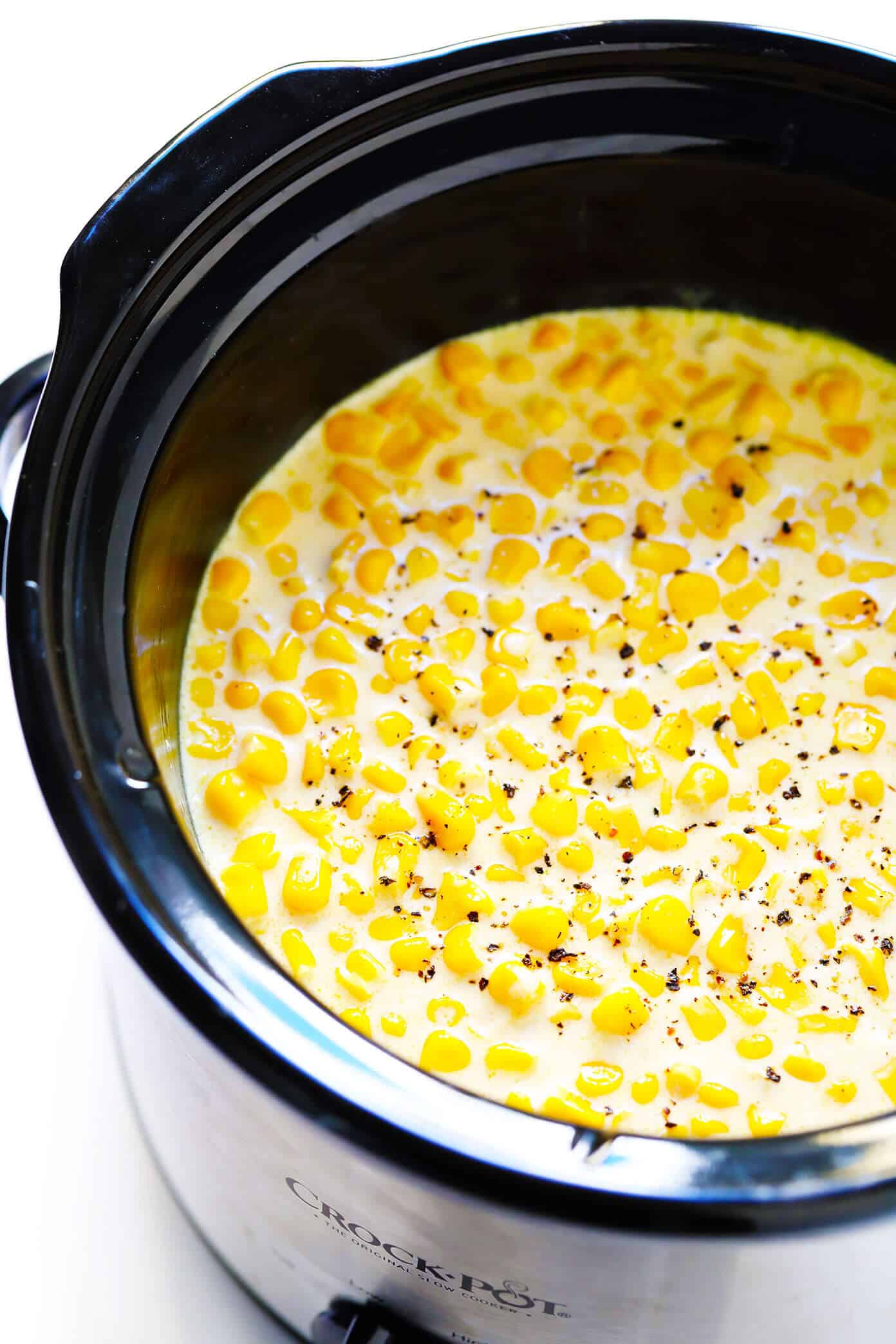 This slow cooker creamed corn recipe is super-easy to make in the Crock Pot (or on the stovetop), it's perfectly rich and creamy, and it's easy to customize with any of your favorite add-ins (herbs, cheese, etc). It's the throwback side dish that's always a crowd fave for Thanksgiving, Christmas, or anytime you're craving some classic comfort food. | gimmesomeoven.com #creamed #corn #thanksgiving #christmas #side #glutenfree #vegetarian #makeahead #crockpot #slowcooker How To Make Creamed Corn (Crock Pot or Stovetop)