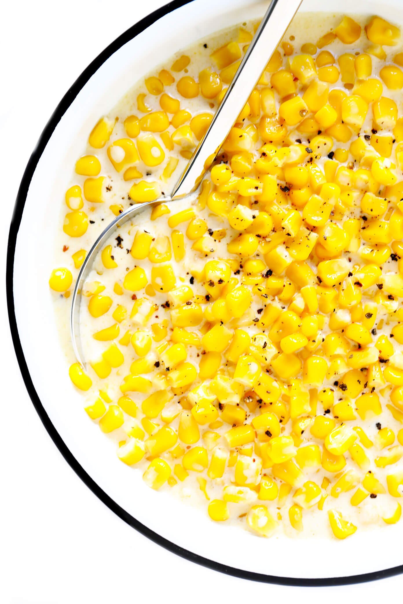 This slow cooker creamed corn recipe is super-easy to make in the Crock Pot (or on the stovetop), it's perfectly rich and creamy, and it's easy to customize with any of your favorite add-ins (herbs, cheese, etc). It's the throwback side dish that's always a crowd fave for Thanksgiving, Christmas, or anytime you're craving some classic comfort food. | gimmesomeoven.com #creamed #corn #thanksgiving #christmas #side #glutenfree #vegetarian #makeahead #crockpot #slowcooker CrockPot Creamed Corn Recipe
